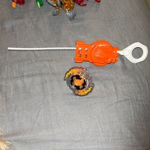 Beyblade with launcher.
